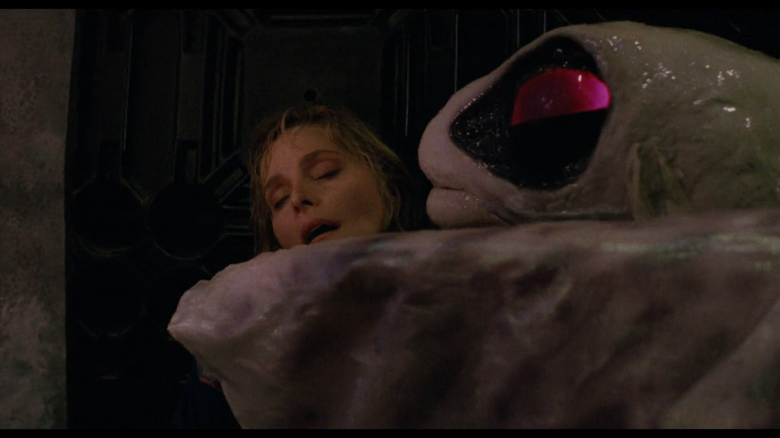 A Ray Creature from Lords of the Deep embracing Dr. Claire McDowell