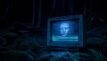 An image of a computer screen in the middle of the woods. A creepy looking distorted face stares out from the screen